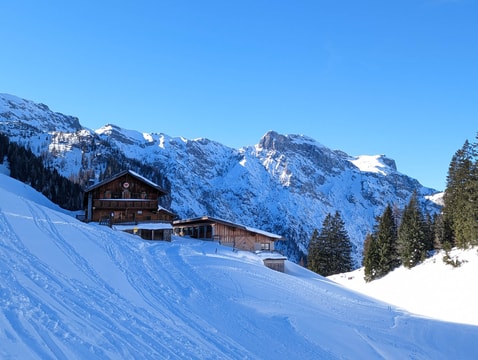 Hut in snow with Karwandel mountains in the background