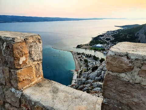 Omiš beach together with merging of Cetina in the sea from the top of Fortica fortress