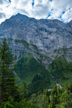 Mountain with the steep cliff and a small watterfall